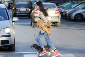 girl, child, teenager, dog, animal, company, pet, small, leash, running, pass, pedestrians, street, cars, traffic, urban, city